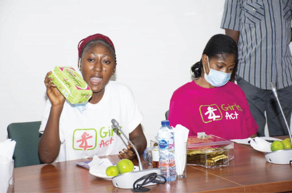 Girls Act peer leader Farida Omenge reiterates to members of parliament the tie between access to reusable sanitary pads and keeping girls in school