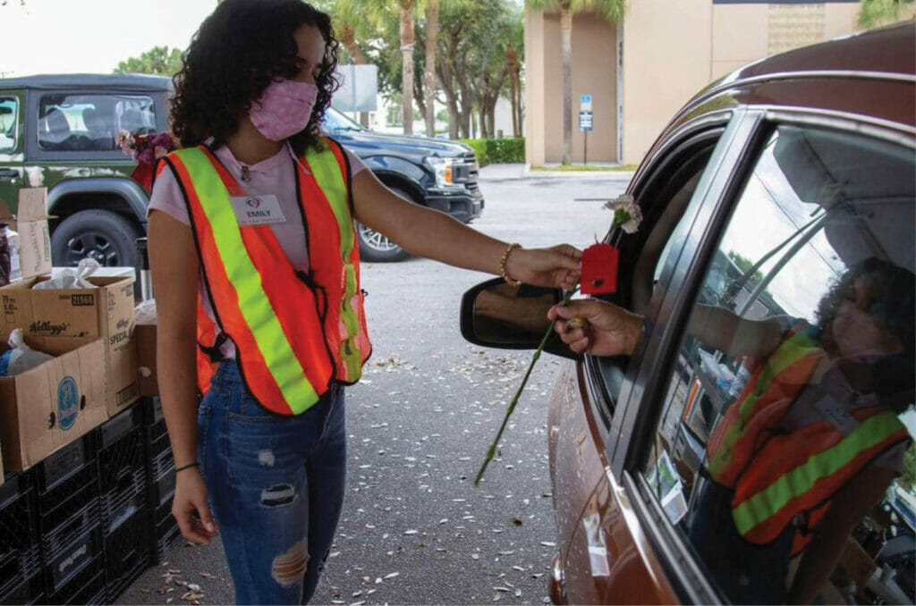 Emily Miranda _ Giving flower to a driver