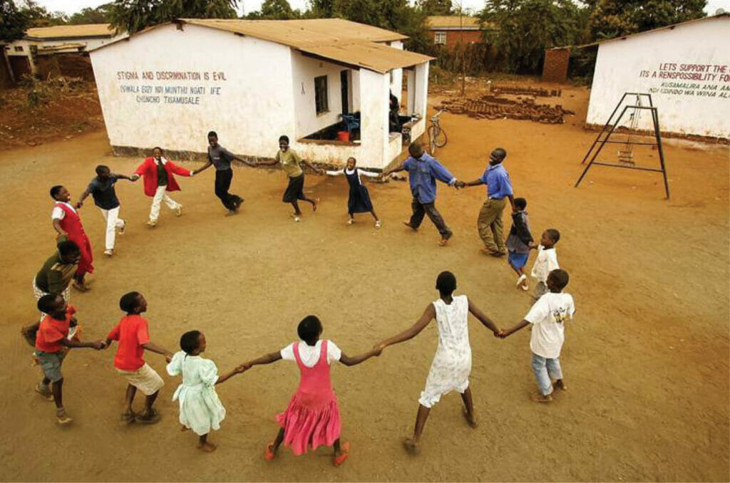 2005 | Lilongwe, Malawi. Orphans sing and dance at Kanego AIDS Support Organization, one of many groups caring for the country’s AIDS orphans.
