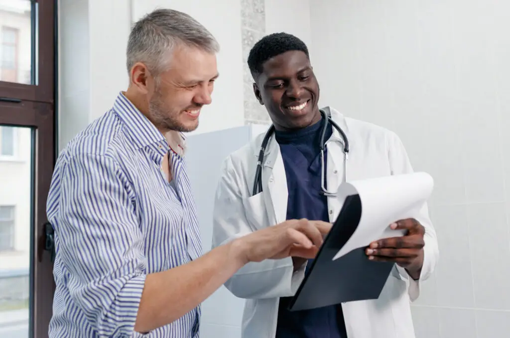 young-africanamerican-doctor-consultations-with-patient-medical-office