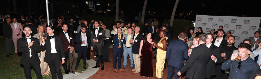 Guests enjoying outdoor performances and dance riverside after the main ballroom event