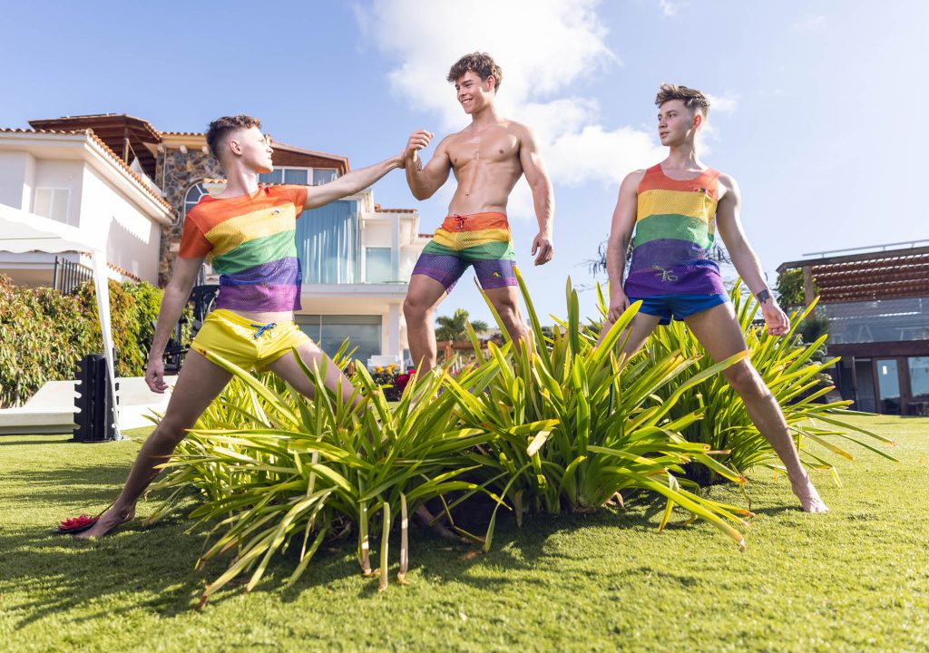 Addicted- Photo of 3 guys wearing rainobow color cloth