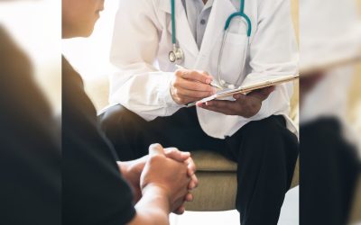 Doctor consulting male patient, working on diagnostic examination on men's health disease or mental illness, and writing on prescription record information document in clinic or hospital office.