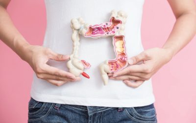 woman with colorectal cancer concept on the pink backgorund