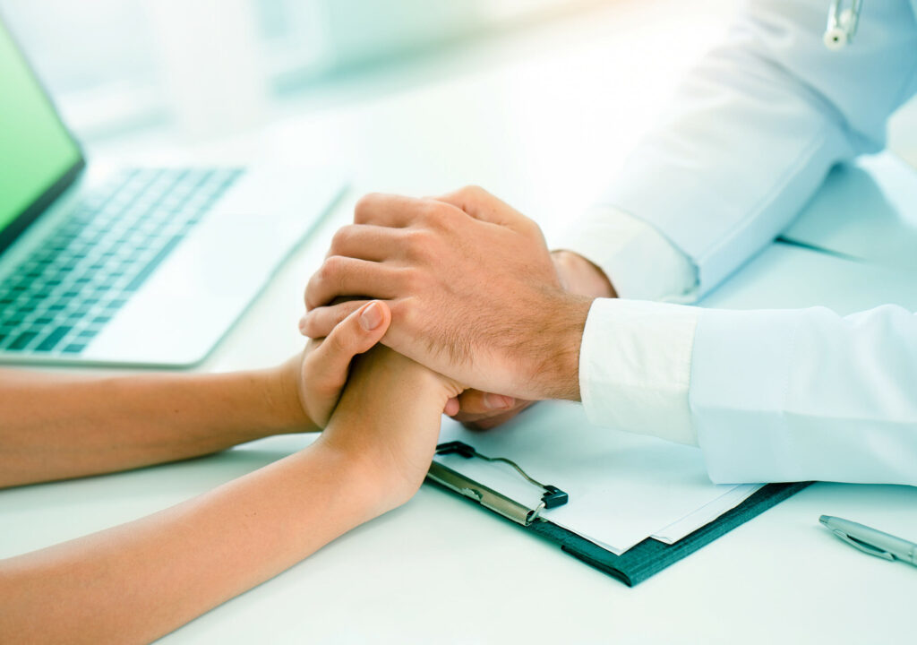 Doctor's hand is holding the patient's hand. Thought-Based Therapy Personal changes such fresh start. self-care mental health. Including PTSD and suicide prevention. Psychological concept