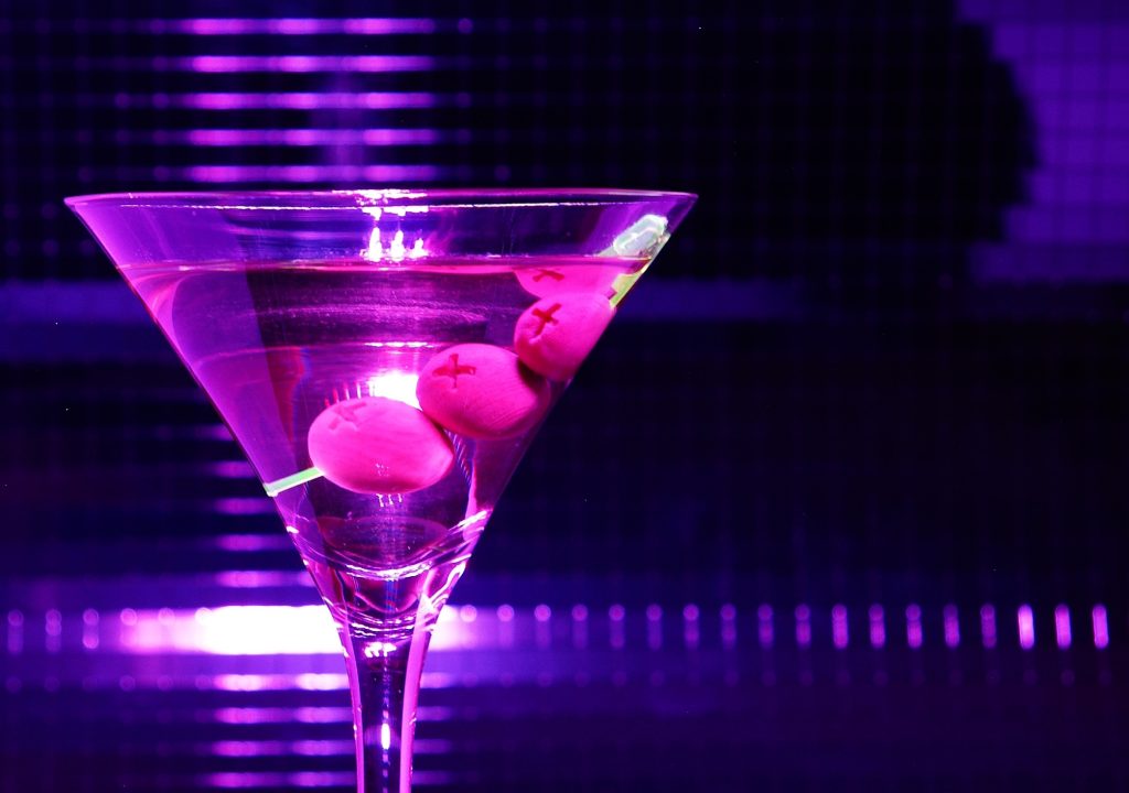 Violet martini glass. Violet olive in martini glass