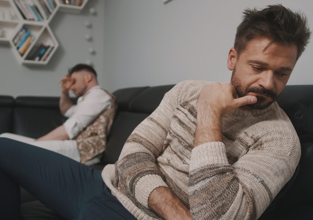 Feeling offended. Gay couple having an argument. Ups and downs in relationship. High quality photo