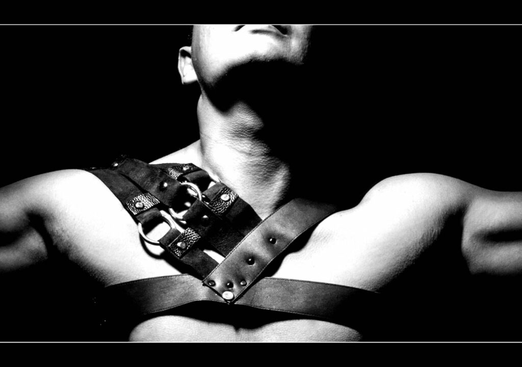 Detail of athletic man harness with spikes