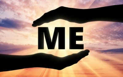 Concept of selfishness and self-love. Silhouette of two hands in the center of word me