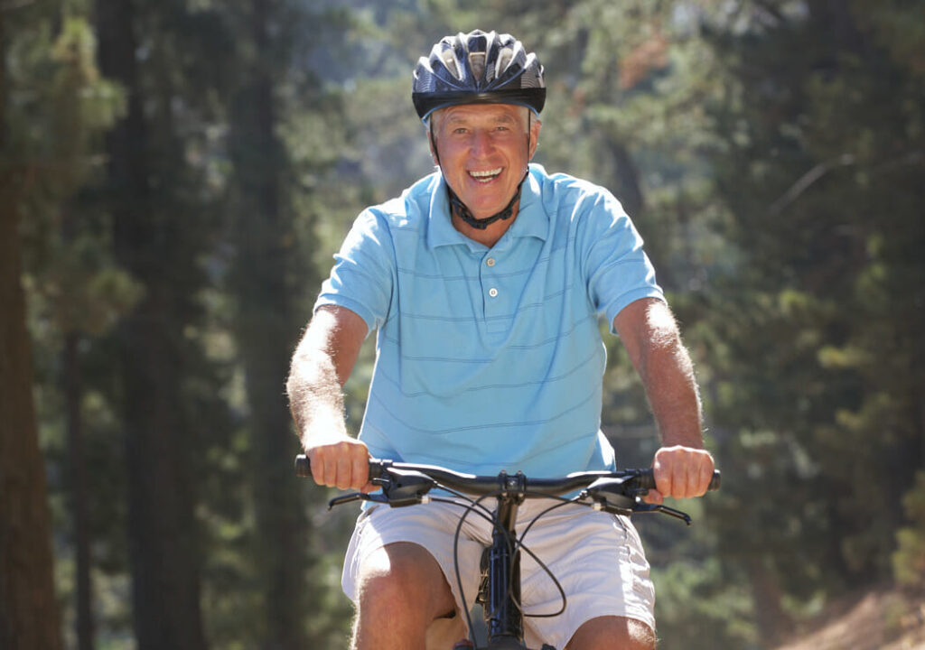 Senior man on country bike ride
