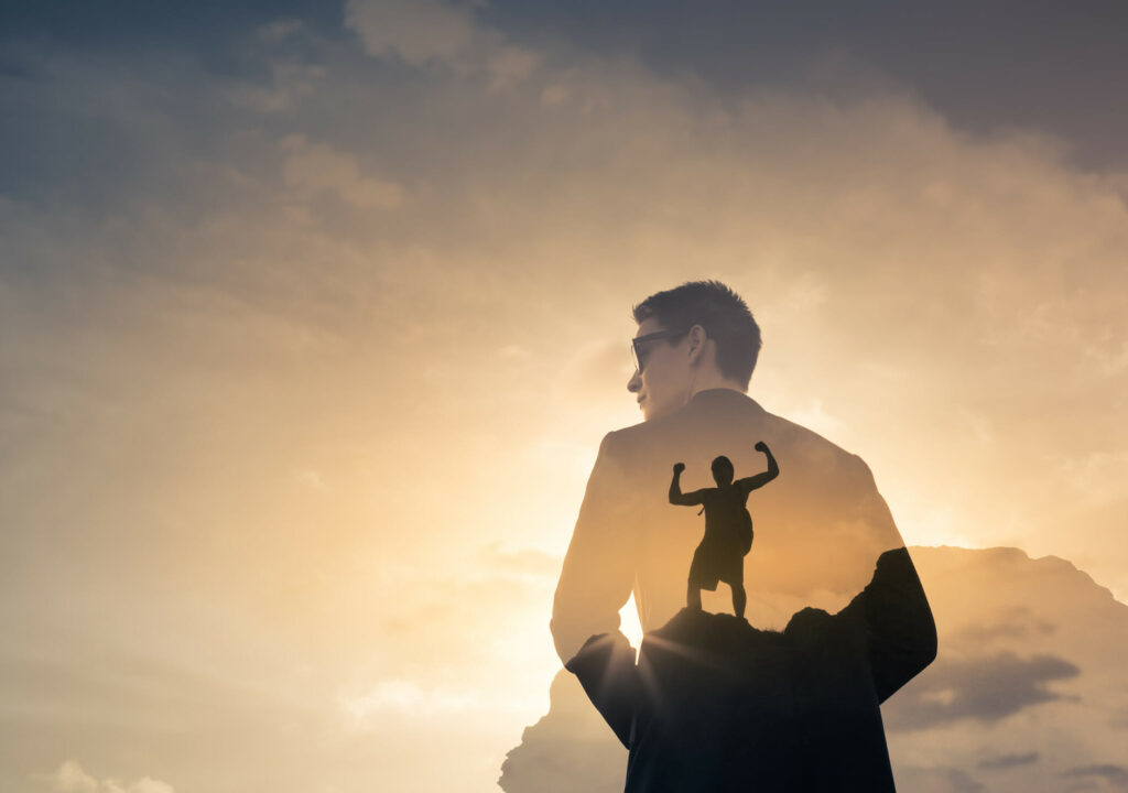 Strong businessman feeling determined and motivated. Double exposure