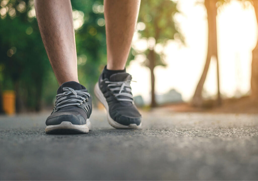 Man running on the park with Close up shoes
