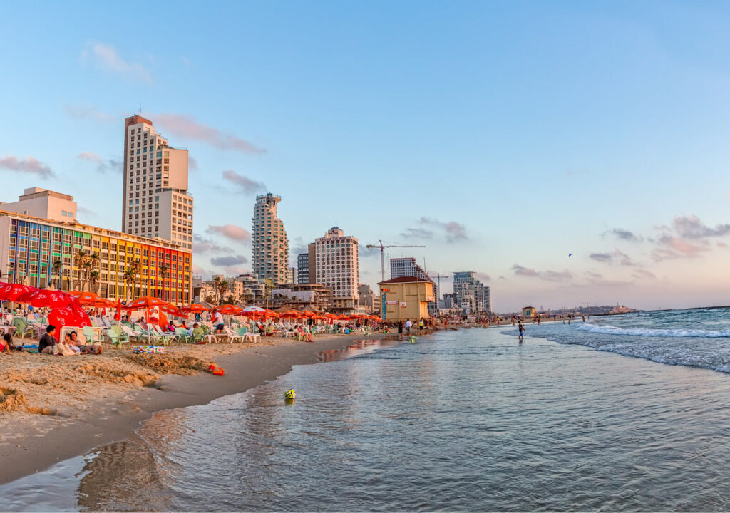 TEL AVIV, ISRAEL - JUNE 19, 2015: Panorama of the beach, riviera, hotels and long promenade along skyline shot from the marine.