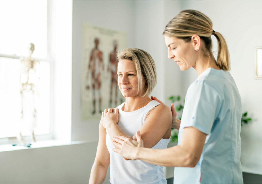 A Modern rehabilitation physiotherapy worker with woman client
