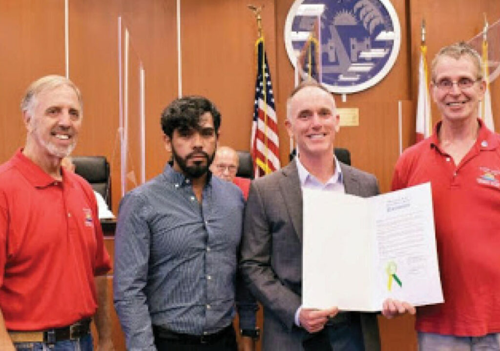 Pictured: City of Wilton Manors Community Affairs Advisory Board's Michael Sansevero and Robert Hadley (in red shirts) with Latinos Salud’s Rafaelé Narváez and Stephen Fallon.