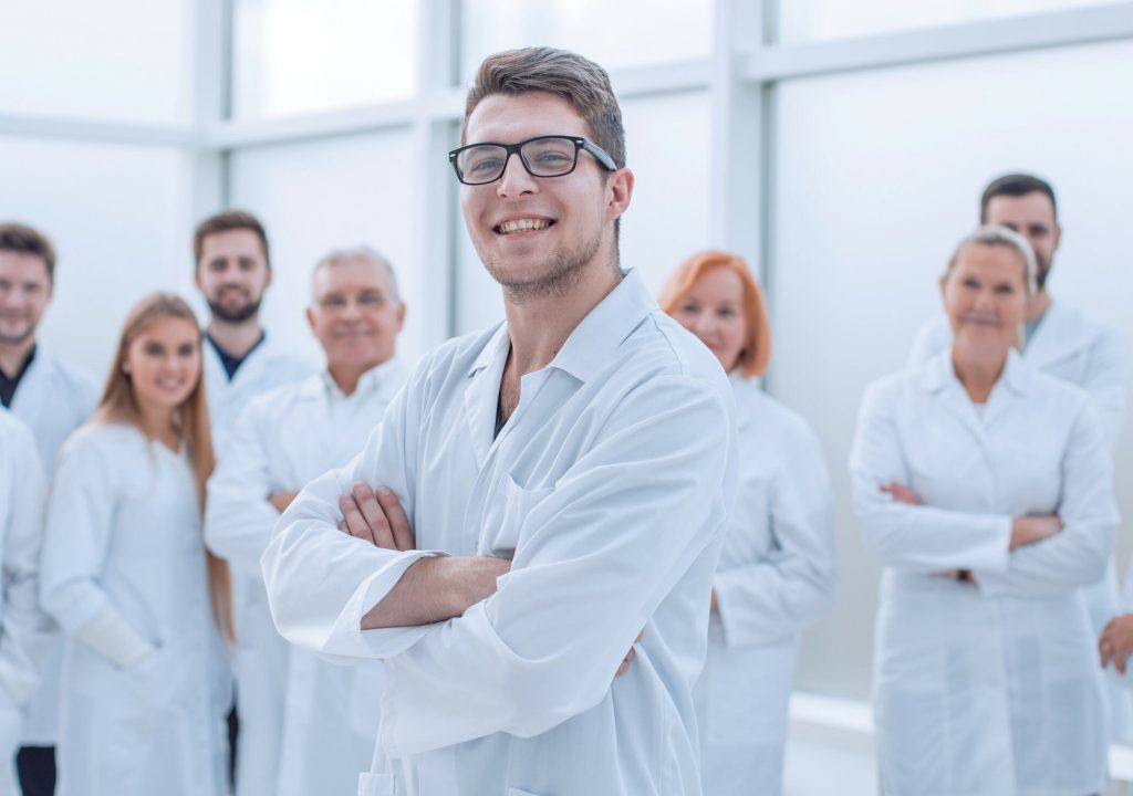group of confident medical professionals standing together.