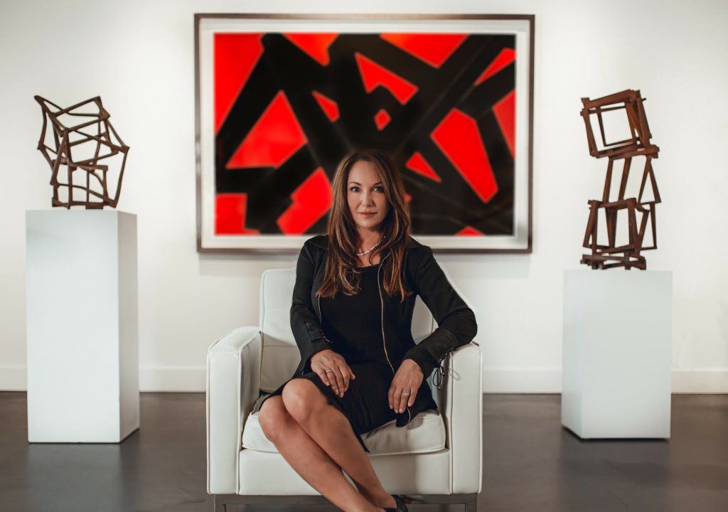 Lisa Burgess with an artist from Burgess Modern + Contemporary