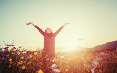 lifestyle concept - beautiful happy woman enjoying fresh air in cosmos flower field